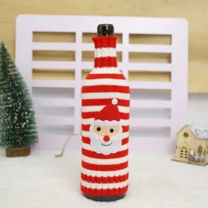 Festive knitted Christmas wine bottle cover featuring red and white stripes with Santa Claus