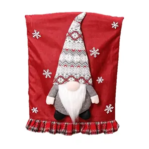 Red festive Christmas chair cover with plush gnome and snowflake pattern decor