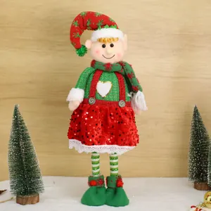 Kerstelf pluche pop met rode pailletten jurk en feestelijke puntmuts decoratie