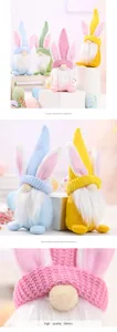 Detail view of Easter bunny gnome dolls showing knitted fabric texture and soft beards.