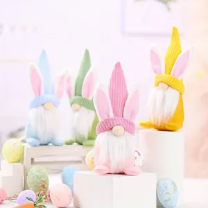 Set of four colorful Easter rabbit ear gnomes with knitted hats and long white beards