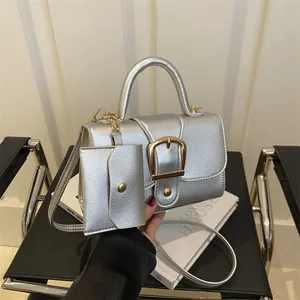 Metallic silver small square bag with retro gold buckle and matching mini hanging pouch