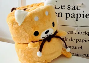 Gros plan d'une couverture en flanelle Shiba Inu enroulée avec un nœud décoratif