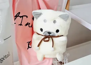 Couverture peluche Shiba Inu blanc roulée en forme de chiot avec un nœud marron.