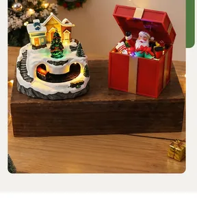 Decorative glowing Christmas snow house resin music box with Santa Claus gift box detail