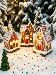 Vista dettagliata di tre magiche case di pan di zenzero a LED su sfondo innevato
