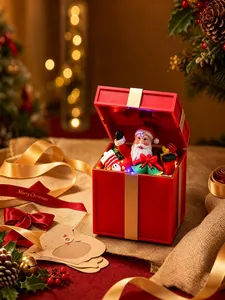Detailed view of glowing red Christmas music box with Santa Claus and festive decor.