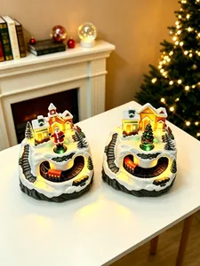 Detailed view of luminous Christmas snow scene music boxes with rotating Santa and train