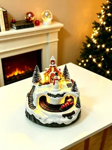 Detailed view of a glowing Christmas snow scene ornament featuring a rotating toy train