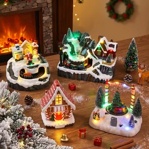 Set of glowing resin Christmas village houses and music box ornaments for holiday decor