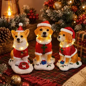 Glowing Christmas dog figurines in Santa outfits, festive resin table ornaments