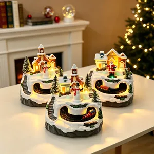 Festive Christmas snow village set with glowing cabin and rotating train desktop ornament