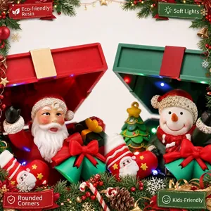 Musical Christmas gift box ornament featuring Santa, snowman and soft LED lights