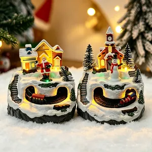 Light-up Christmas snow village scene with rotating train and festive figurines
