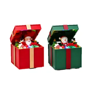 Christmas music box ornaments with glowing LED lights in red and green gift box designs