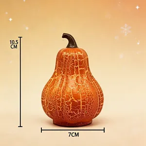 Vista detallada de luz nocturna de calabaza con 10,5 cm de alto y 7 cm de ancho