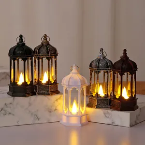 Close-up of five decorative vintage LED lanterns displayed on marble textured blocks