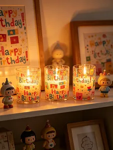 Detail shot of glowing LED birthday candles with colorful Happy Birthday UV prints.