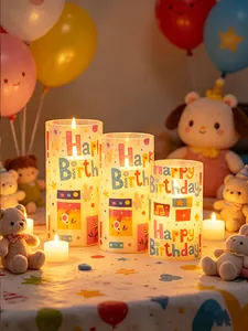 Detail view of LED birthday candles with Happy Birthday print in a festive setting.