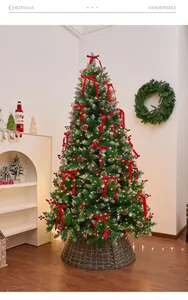 Detailed view of decorated Christmas tree with pine cones and red bows in home