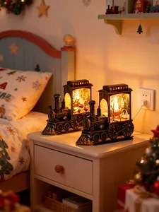 Decorative vintage Christmas LED train lantern night light set on a cozy bedside table