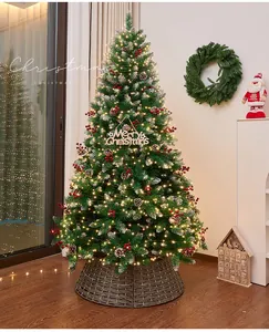 Detailed view of decorated Christmas tree with pine cones, red berries and warm lights