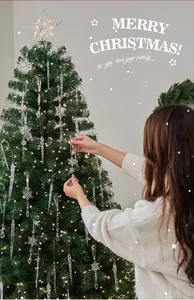 Close-up view of elegant crystal-clear snowflake and icicle ornaments on a Christmas tree