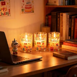 Set of 3 LED electronic birthday candles in glass with warm light effect.