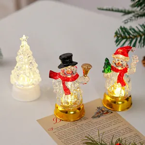 Bonshommes de neige de Noël à LED et sapins lumineux pour décoration de table de fête.