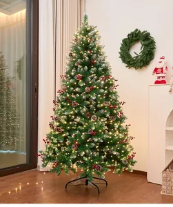 Close-up detail of pre-lit Christmas tree with pine cones and festive red berries decor