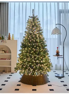 High-end large Christmas tree with warm fairy lights and wicker base in living room