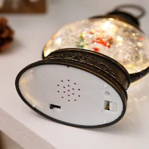 Detail view showing bottom battery compartment and 3-way power switch of Christmas globe lantern.