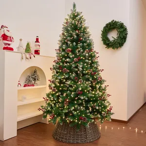 Pre-lit artificial Christmas tree with pinecones and red berries on a woven base.