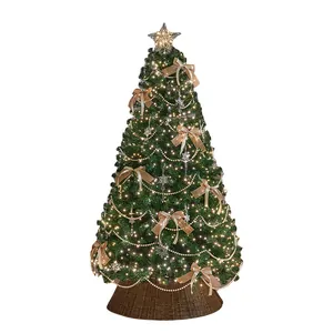 Luxury pre-lit Christmas tree with golden bows and pearl garlands for home decor