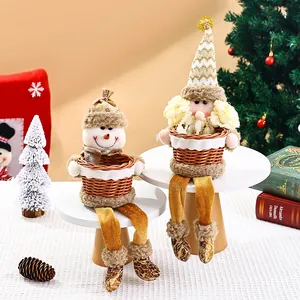 Detail view of festive Christmas Santa and Snowman fruit baskets for table decoration.
