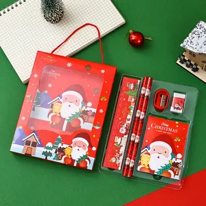Detailed view of a Christmas stationery gift set with Santa Claus illustrations in a red box
