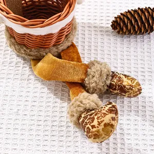 Close-up of decorative plush Santa Claus legs and woven fruit basket for Christmas