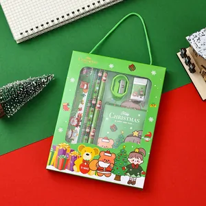 Detailed view of green Christmas stationery gift box set with festive cartoon characters