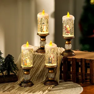Detail of Christmas water candles with miniature scenes and swirling glitter.