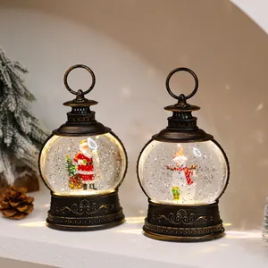 Detailed view of bronze Christmas snow globe lanterns with Santa and snowman figurines