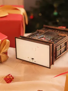 Close-up of the functional switch and battery compartment of the Christmas music box.