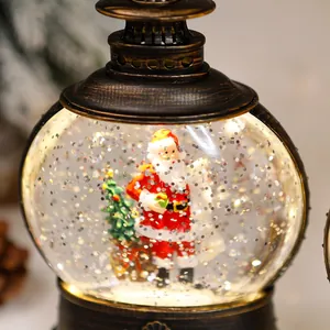 Detail shot of vintage Christmas snow globe lantern featuring Santa Claus and tree