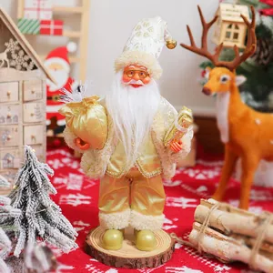 12-inch standing Santa Claus doll in gold outfit with gift sack and festive background