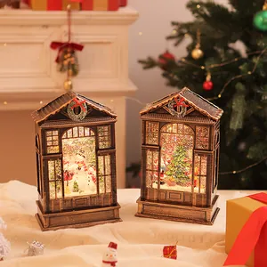 Pair of vintage bronze Christmas LED snow globe lanterns in a festive holiday scene