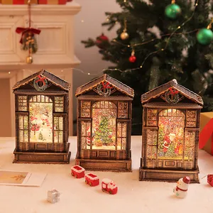 Macro view of three vintage Christmas lanterns with LED glowing snow globe effects