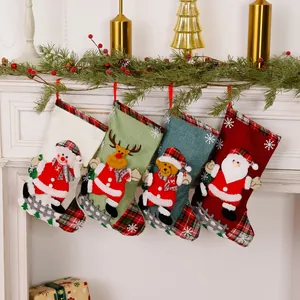 Set of four festive burlap Christmas stockings hanging on a classic white mantel