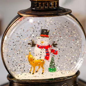 Detailed view of internal Christmas snowman and deer scene in water-filled lantern.