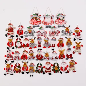 Collection of assorted plush Christmas ornaments featuring Santa, reindeer and snowman