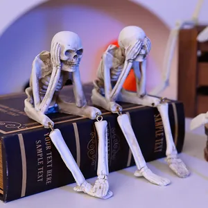 Set of Halloween skeleton shelf sitters in 'see no evil' and 'hear no evil' poses