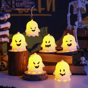 Set of glowing Halloween ghost night lights with different cute expressions on props